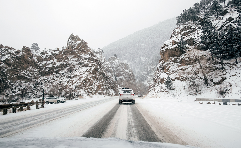 Drivers on a snowy road in Denver