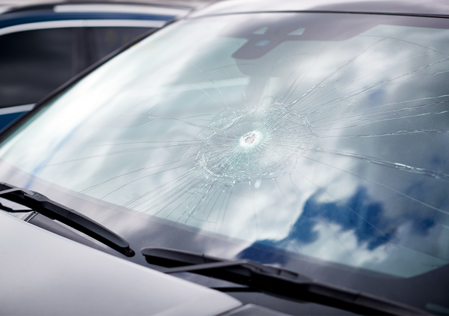 a car windshield with a large crack