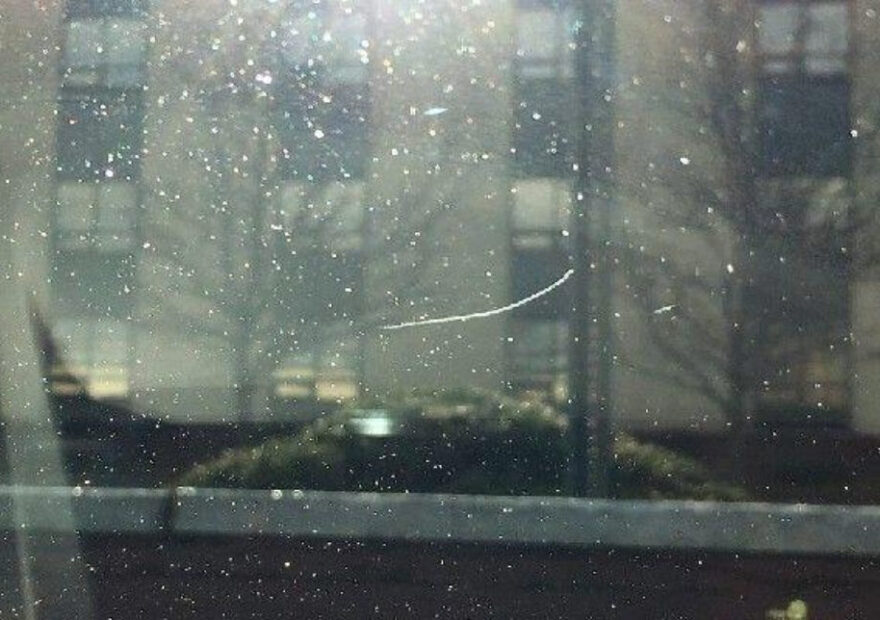 a windshield with pitting